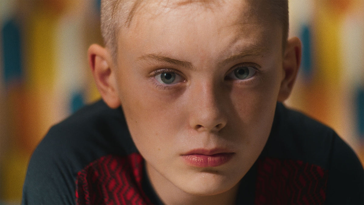 HueCrafter© AMARO 100 film print emulation on a close-up portrait of a young boy