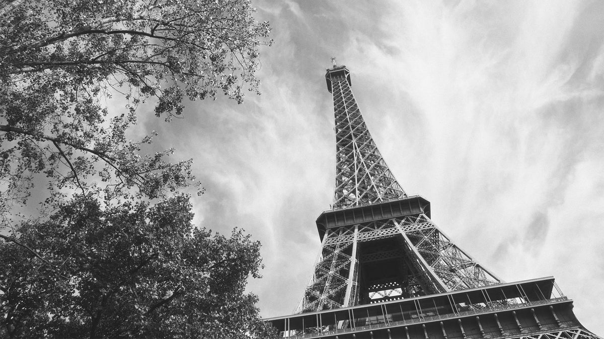 HueCrafter© FERRA 500 black-and-white film print emulation on the Eiffel Tower under dramatic clouds