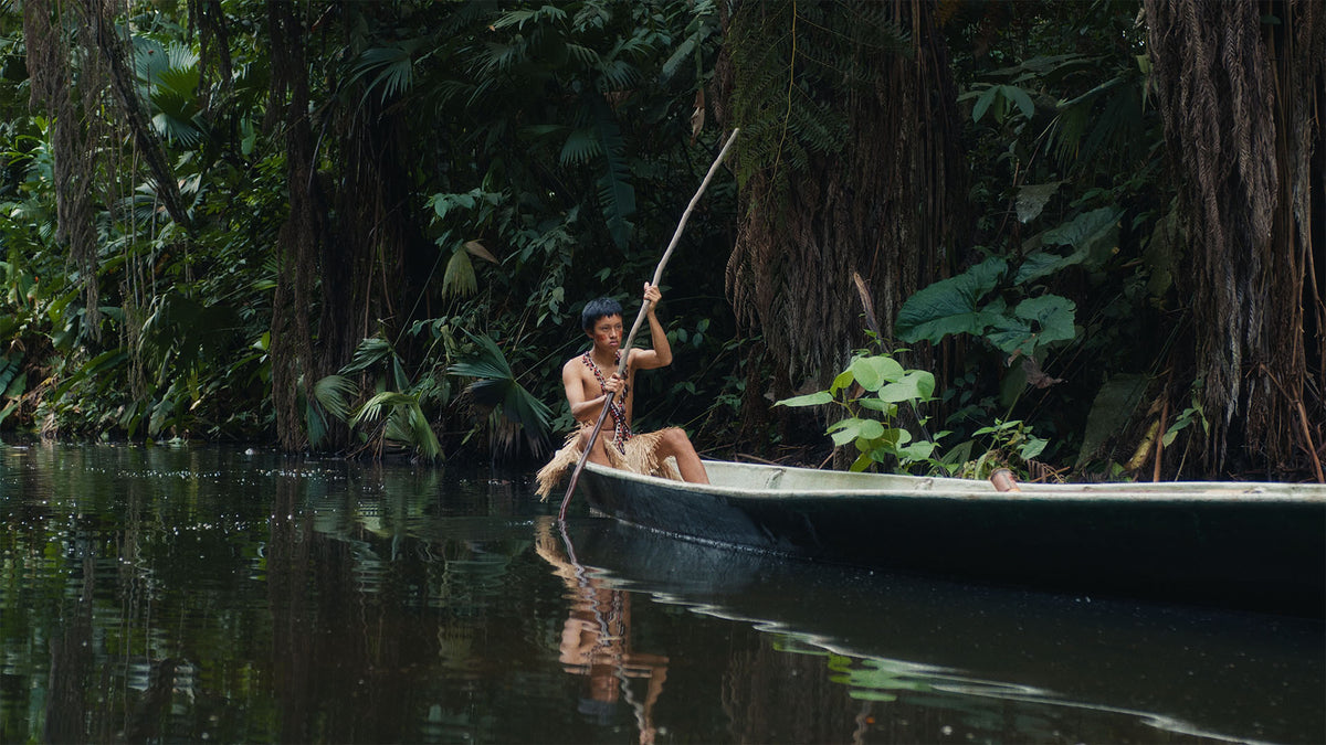 HueCrafter© ORO 200 film print emulation on a person poling a canoe on a jungle river